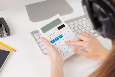 woman hands working with calculator close upの写真素材