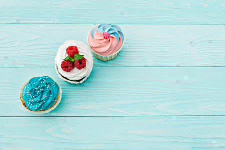 delicious cupcakes on a colored background. Festive background, birthdayの写真素材