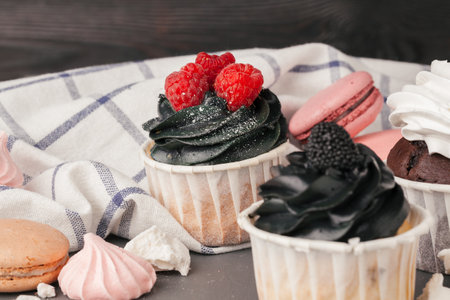 Delicious raspberry cupcakes on dark background - Handmade Sweet dessertの写真素材