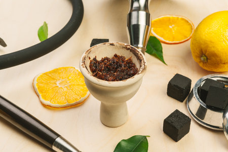 Parts of hookah and fruits on wooden background