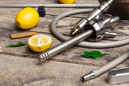 Parts of hookah and fruits on wooden backgroundの写真素材