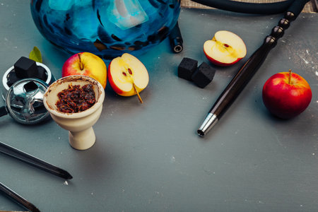 Parts of hookah and fruits on wooden backgroundの写真素材