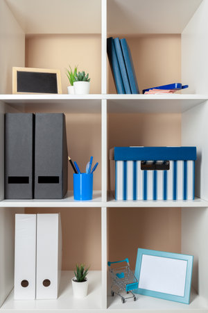 File folders, standing on the shelves at officeの写真素材