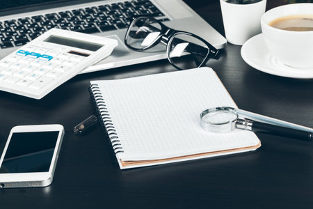 Pen and notebook up close on an office desk