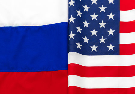 Usa american flag and Russian flag together backgroundの写真素材