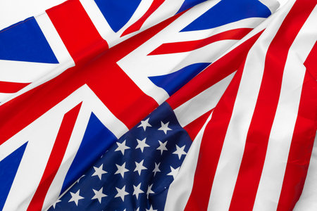 Flags of the USA and brithish Union Jack flag together waving