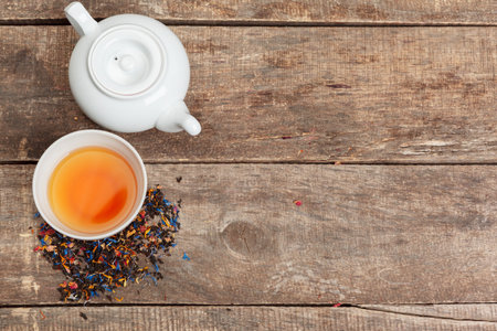 Collection of different teas in cups with tea leavesの写真素材