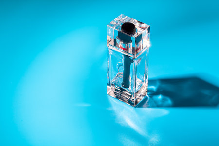 perfume glass bottle on light blue background. Eau de toiletteの写真素材