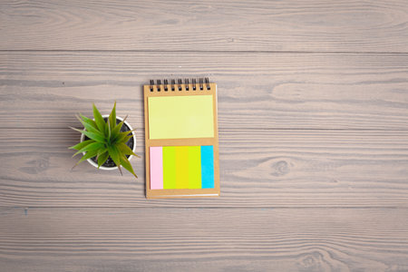 Notepad open paper close up on wooden tableの写真素材