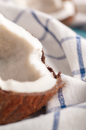Fresh organic coconut on rustic background close up