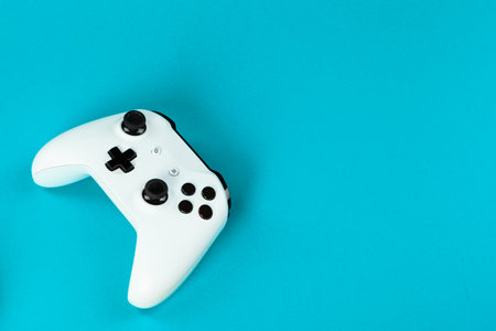 Gaming concept. Joystick on color background.