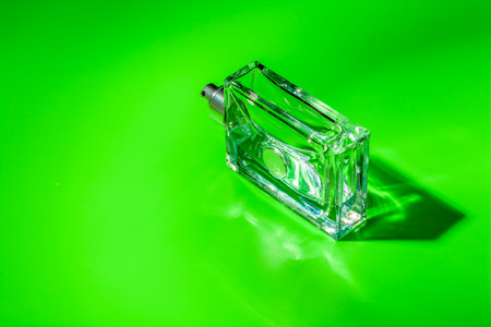 perfume glass bottle on light green background. Eau de toiletteの写真素材