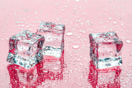 Ice cubes on pink background