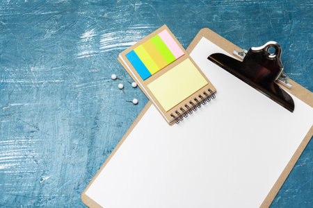 Notepad open paper close up on wooden table
