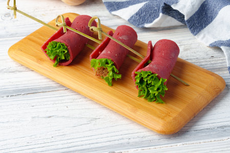 Meat rolls in plate on banquet table