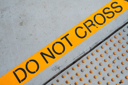 Concrete pier with yellow designations close upの写真素材