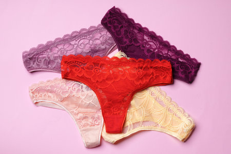 Womens panties on pink background with copy space