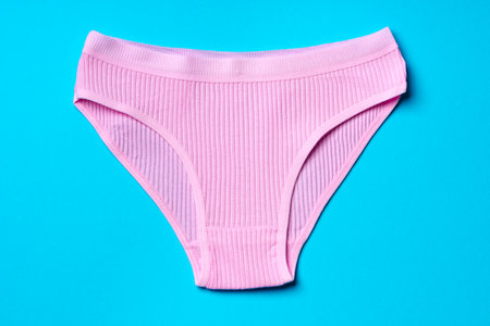 Womens panties on a blue background in studio