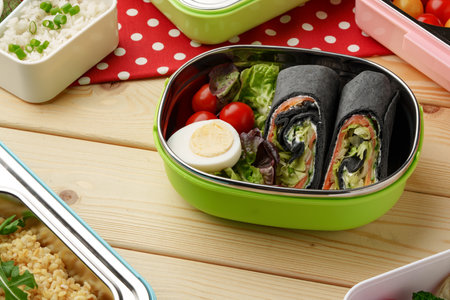 Containers with healthy food on wooden background top view.