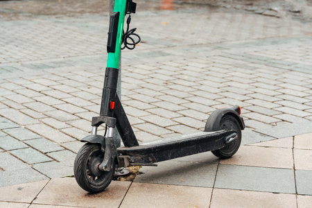 Modern electric scooter parked on the streetの写真素材