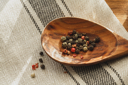 Striped linen napkin on wooden table close up