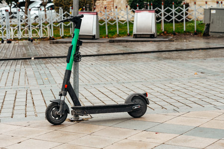 Modern electric scooter parked on the streetの写真素材