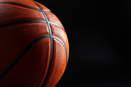 Basketball ball close up on dark black backgroundの写真素材