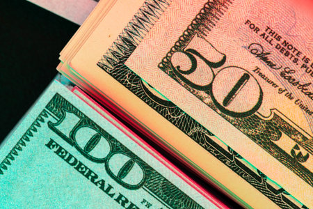 money background from dollars in neon light, close upの写真素材