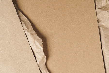 Crumpled craft paper with carton sheets close upの写真素材