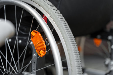 Close up view of a wheel of wheelchairの写真素材