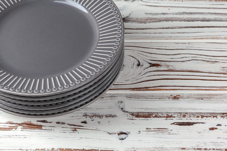 Wooden kitchen counter with new dishware on itの写真素材