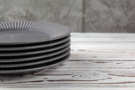 Wooden kitchen counter with new dishware on itの写真素材