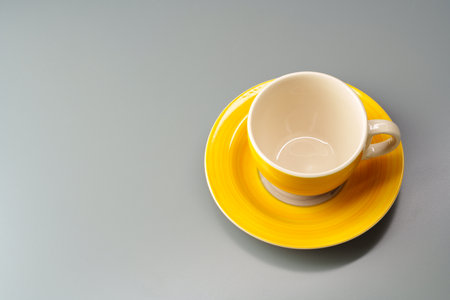 Top view of ceramic cup with saucer on gray backgroundの写真素材