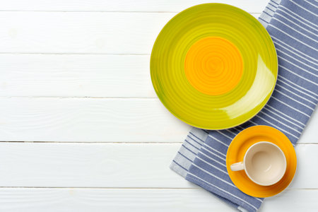 Top view of color ceramic plate on wooden backgroundの写真素材