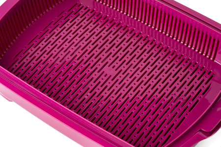 Plastic toilet tray for cats on a white background