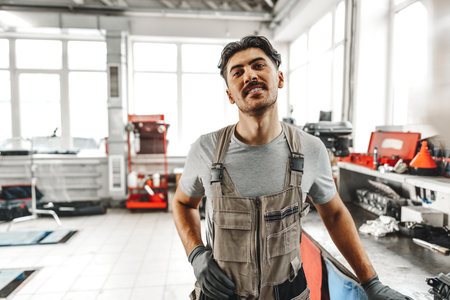 Portrait of a male mechanic in an auto repair shopの写真素材