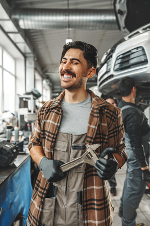 Portrait of a male mechanic in an auto repair shopの写真素材