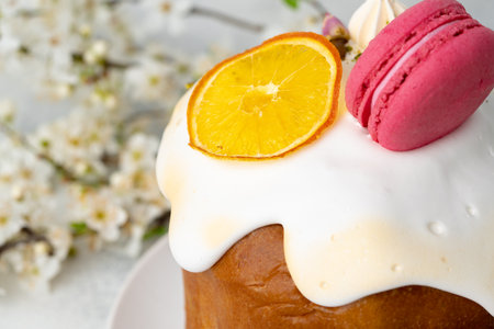 Beautiful Easter cake decorated with macarons cookie and dry orange pieceの写真素材