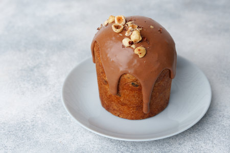 Ester cake with chocolate topping and nuts on gray backgroundの写真素材