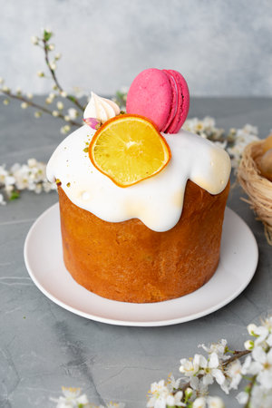 Beautiful Easter cake decorated with macarons cookie and dry orange pieceの写真素材