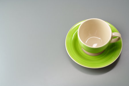 Top view of ceramic cup with saucer on gray backgroundの写真素材