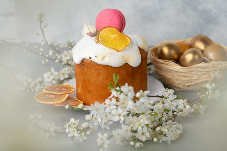 Beautiful Easter cake decorated with macarons cookie and dry orange piece