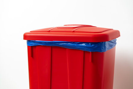 Plastic waste bin with a lid in the roomの写真素材
