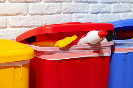 Trash cans full of waste in the buildingの写真素材