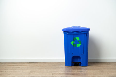Plastic waste bin with lid in the roomの写真素材