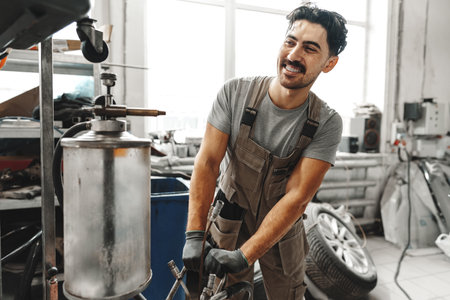Portrait of a male mechanic in an auto repair shopの写真素材