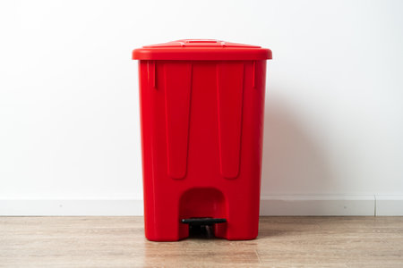 Plastic waste bin with a lid in the roomの写真素材