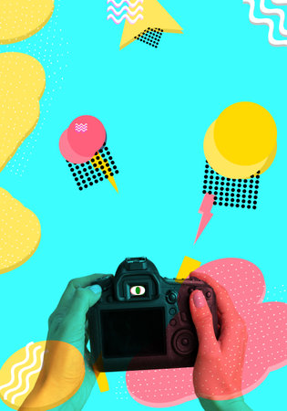 Hands holding camera close up abstract geometric backgroundの写真素材