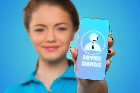 Smiling young woman showing blank smartphone screen
