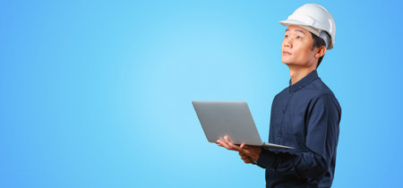 Man asian engineer with laptopの写真素材